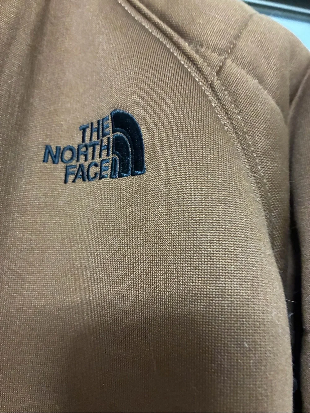 The North Face Men's Brown Hooded Puffer Jacket with Black Accents reversible